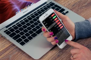 lady working on mobile phone and laptop