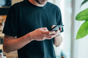 Man texting on mobile phone